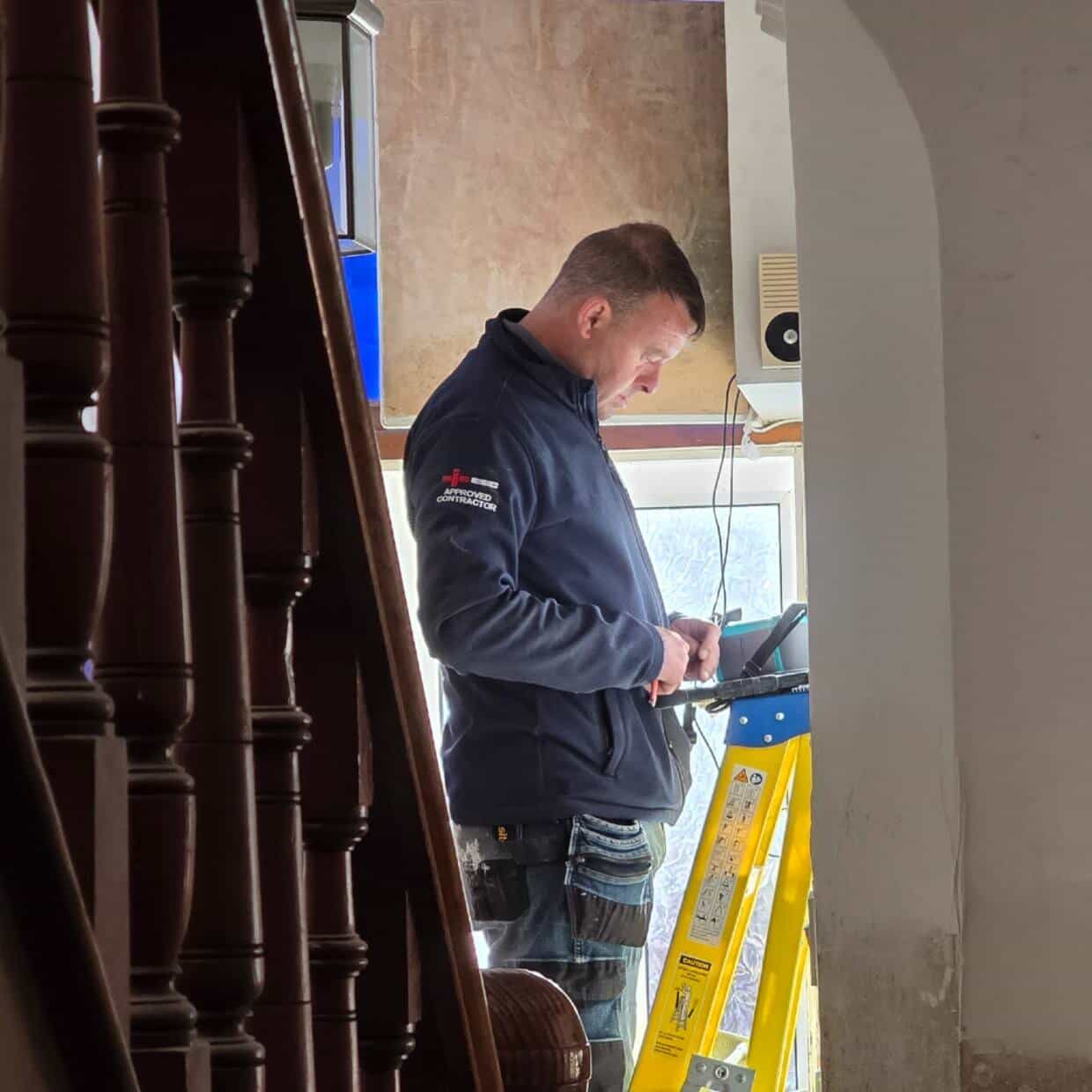An Assured electrician working at a domestic property